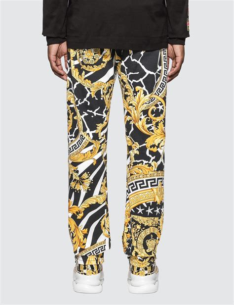 versace trousers black and gold|Versace denim pants.